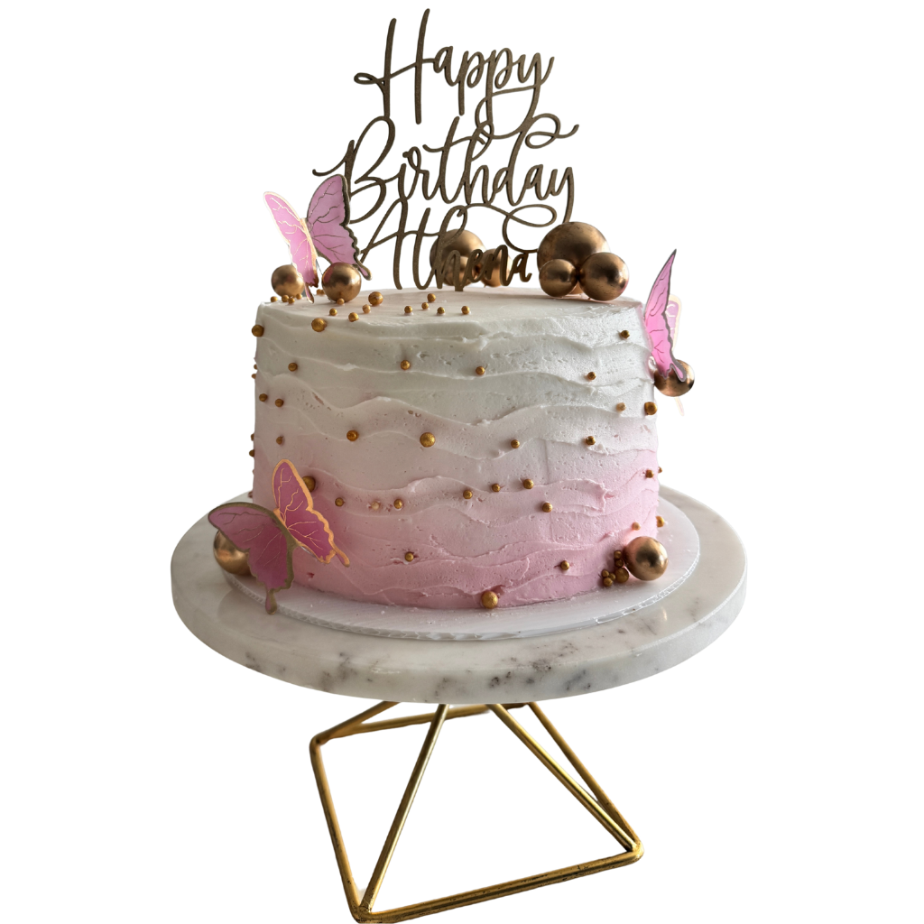 Pink ombré buttercream cake with gold pearls and pink butterflies